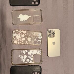 Silver iPhone with Black and Clear Floral Cases